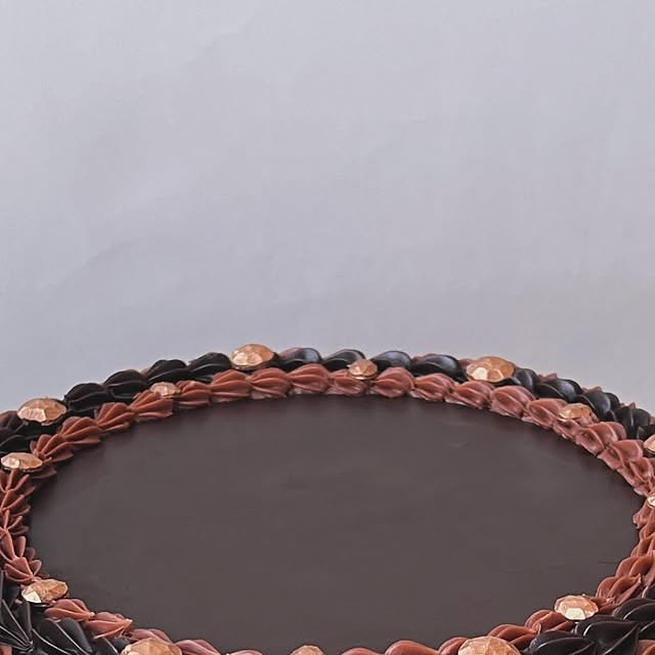 Ganache cake with piped border