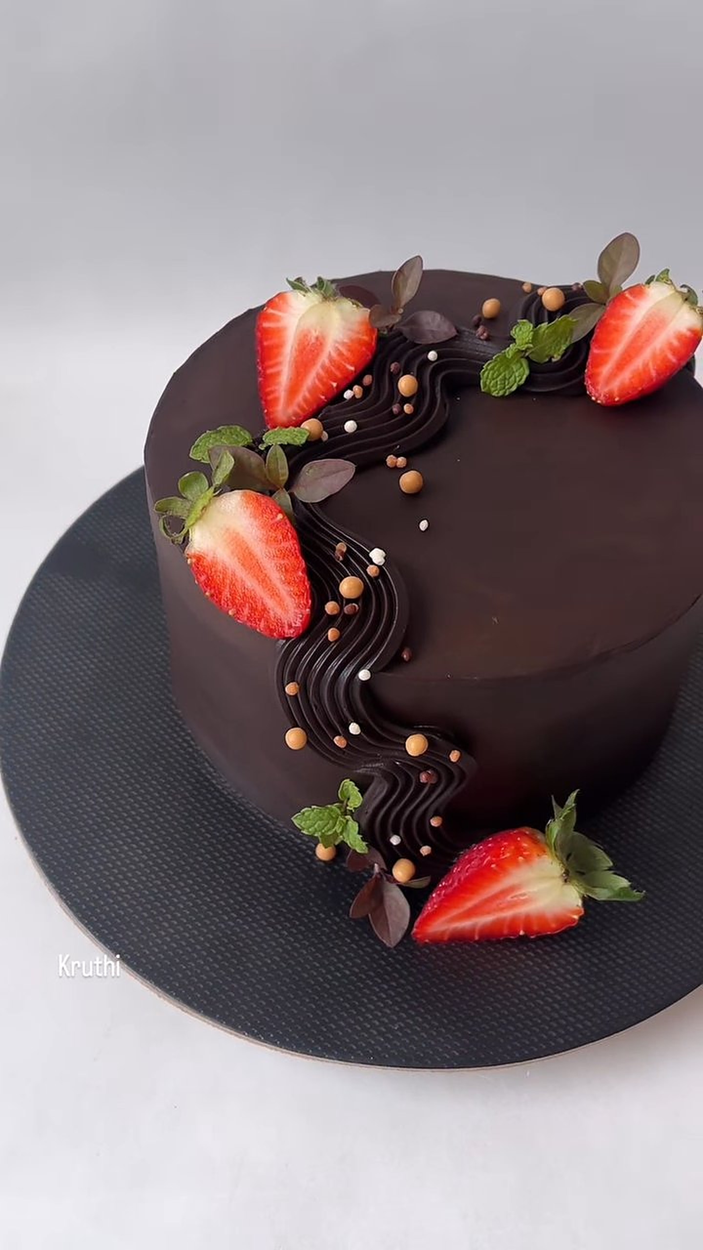 Chocolate cake topped with fresh strawberries